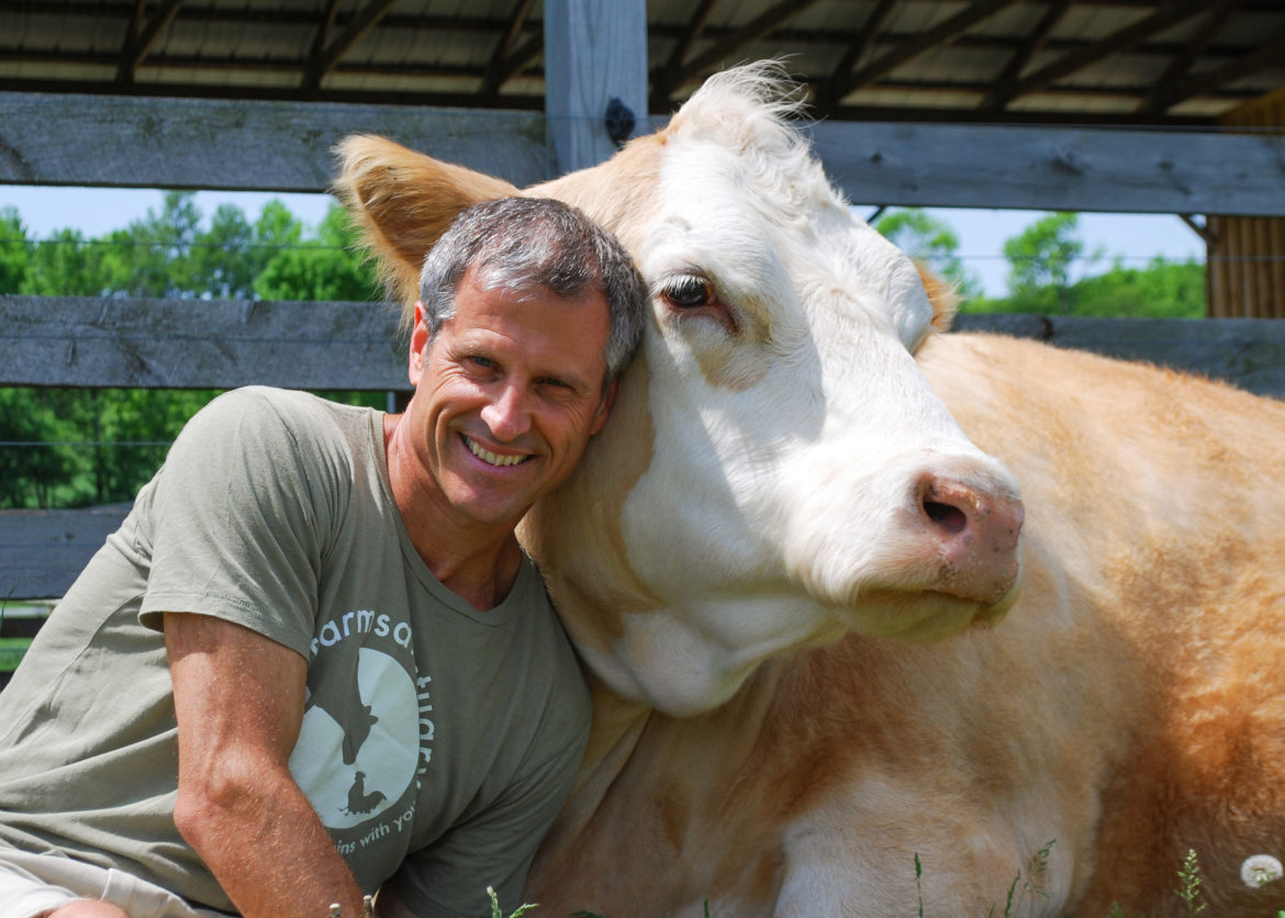 Gene and Cow Living the Farm Sanctuary Life